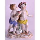 A 19TH CENTURY MEISSEN FIGURE OF A MALE AND FEMALE modelled holding foliage upon an oval base. No.