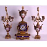 A FINE 19TH CENTURY SEVRES PORCELAIN AND ORMOLU CLOCK GARNITURE the blue enamel panels painted