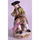 A 19TH CENTURY MEISSEN FIGURE OF A BOY modelled standing beside a begging hound. No. 61. 5.5ins