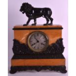 A MID 19TH CENTURY SIENNA MARBLE MANTEL CLOCK supported with a roaming lion, the body smothered in