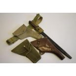 A WWI LEATHER HOLSTER, together with a similar holster in canvas and another in canvas with a