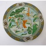 A CHINESE PORCELAIN PLATE, 20th century, of circular form painted in famille verte enamels with