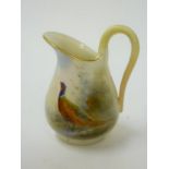 A ROYAL WORCESTER PORCELAIN MINIATURE JUG, c.1906, of baluster form with high loop handle, painted