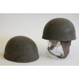 TWO BRITISH DISPATCH RIDER MOTORCYCLE HELMETS, dated 1943 and 1944, with steel shell, padded