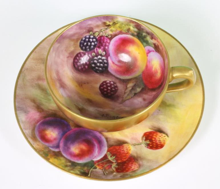 A ROYAL WORCESTER PORCELAIN CABINET CUP AND SAUCER, 1923, painted in polychrome enamels by Edward