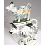 A BAKER, BEVANS & IRWIN, GLAMORGAN POTTERY COW CREAMER AND COVER, c.1830's, of typical form, printed