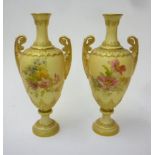 A PAIR OF ROYAL WORCESTER PORCELAIN SMALL TWO HANDLED VASES, 1908, of slender ovoid form with