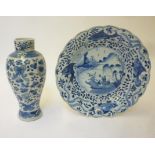 A CHINESE PORCELAIN DISH of shallow, shaped circular form, centrally painted in underglaze blue with