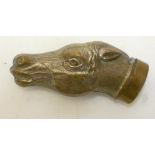 A VICTORIAN BRASS NOVELTY VESTA stamped as a horse's head with hinged cover/strike, 2 1/2" long