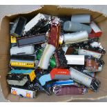 A large quantity of playworn goods trucks including wagons by Hornby, Triang and Hornby Dublo,