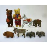 A collection of eight tin plate clockwork animals, all with novelty action comprising two standing