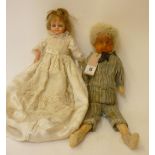 A wax over composition shoulder head boy doll with fixed blue glass eyes, blonde mohair wig and