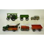 Four Minic clockwork toys comprising Breakdown lorry, with two motors, red/green, 6 1/2" long