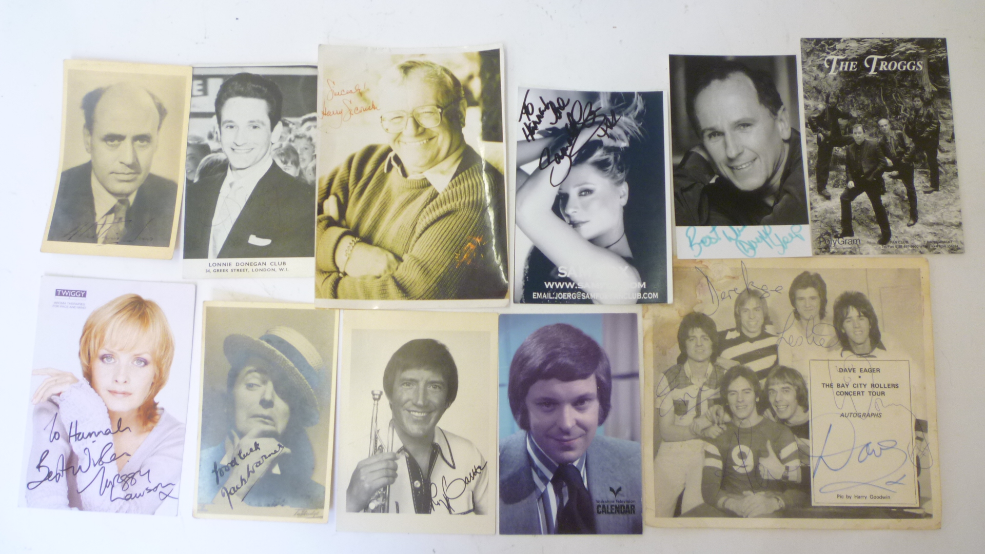 A collection of autographed photographs of stage and screen stars including Twiggy, Ginger Rogers,