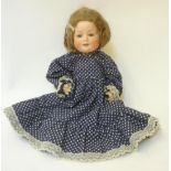 A Bahr & Proschild bisque head character doll with blue glass sleeping eyes, closed mouth, brown