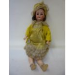 A J. Walther & Sohn bisque head girl doll with blue glass sleeping eyes, open mouth and teeth, brown