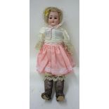 A Heinrich Handwerck bisque shoulder head girl doll with fixed brown glass eyes, open mouth and