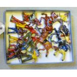 Nine Britains and other metal Red Indian figures, and six cowboys including three mounted, F-G