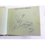 An album containing autographs of Bernard Cribbins, Harry Corbett and Sooty (stuck in), Tommy