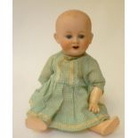 A Franz Schmidt & Co bisque head character toddler doll with blue glass sleeping eyes, open mouth