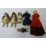 Six bisque shoulder head dolls house dolls comprising a boy with moulded hair, 2 3/4" high, a pair