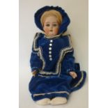 A Kammer & Rheinhardt bisque head doll with blue glass sleeping eyes, open mouth and teeth,