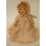 An Ernst Heubach bisque head character girl doll with cry, blue glass sleeping eyes, open mouth,