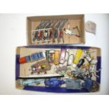 A quantity of metal figures and accessories including Britains trapeze, six various petrol pumps,