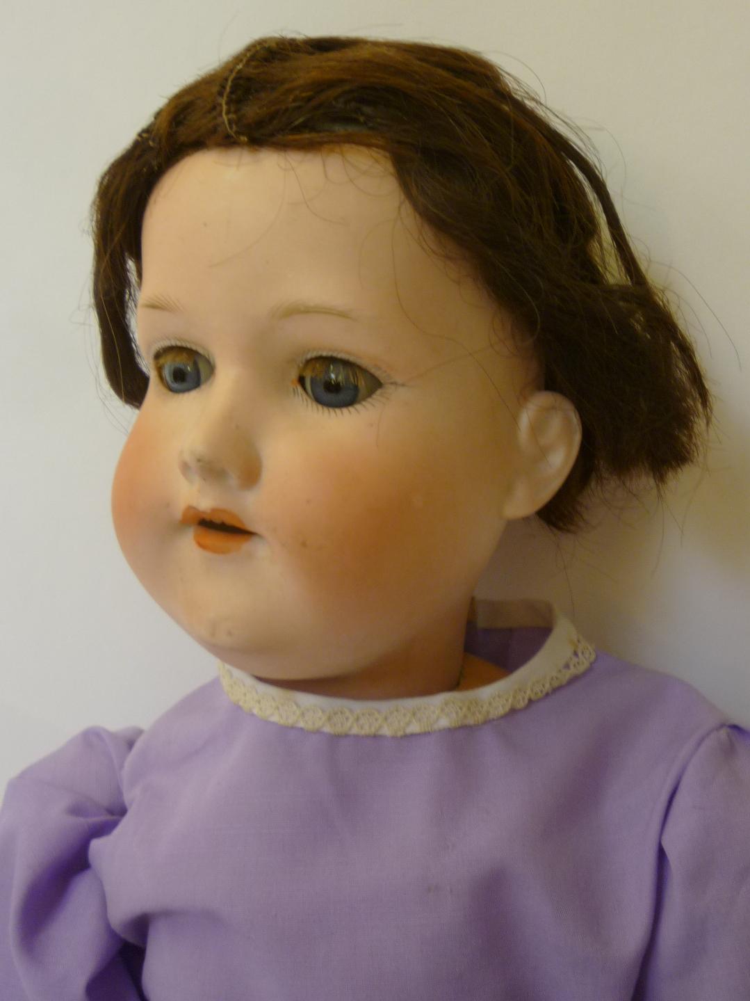 An Armand Marseille bisque head girl doll with blue glass sleeping eyes, open mouth and teeth, brown - Image 2 of 2