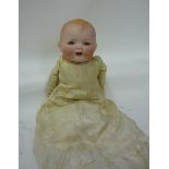 An Armand Marseille "Baby Gloria" bisque head baby character doll with brown glass sleeping eyes,