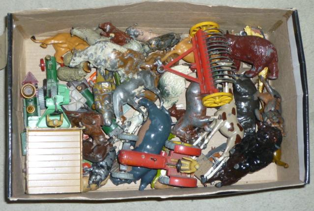 A quantity of Britains metal zoo animals, farmyard animals, figures and equipment, and three Dinky