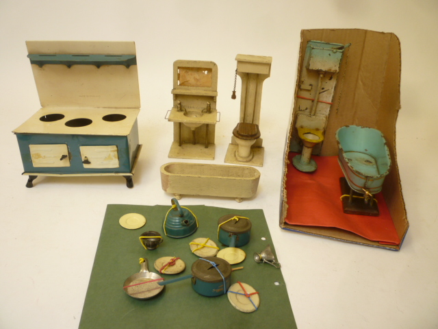 A doll's bathroom set, tinplate, comprising bath and high level W.C., another painted wood