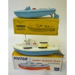 A Sutcliffe Boats Comet Speed Boat, clockwork AF, pale blue, 10" long, box AF, and a Victor Motor