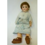 A French "Cherie" bisque head girl doll with fixed brown glass eyes, open mouth and teeth, pierced