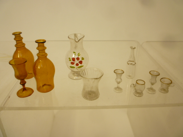 A collection of dolls house equipment comprising glass, pottery and metal table ware and other - Image 3 of 3