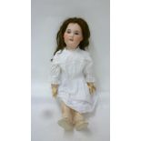 An S.F.B.J. Jumeau mould bisque head girl doll with blue glass sleeping eyes, open mouth and