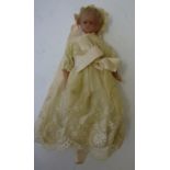 A poured wax shoulder head doll, c.1880, with inset blue glass eyes, blonde mohair wig, stuffed