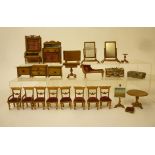 A collection of wood dolls house furniture, mainly early 20th century, comprising a set of two elbow