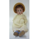 A Schutsmeister & Quendt bisque head character girl doll with blue glass sleeping eyes, open mouth
