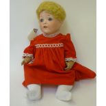 An Edmund Edelmann "Melitta" bisque head doll with blue glass sleeping eyes, open mouth and teeth,