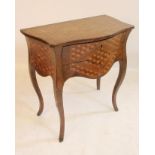 A DUTCH WALNUT AND PARQUETRY COMMODE, early 19th century, of serpentine form, parquetry inlaid top