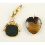 A 9CT GOLD FANCY SWIVEL FOB set with a polished oblong bloodstone panel together with a polished