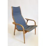 AN OAK (?) BENTWOOD ARMCHAIR, the tapering back and seat in blue linen, shaped arms on pierced