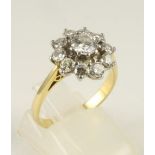 A DIAMOND CLUSTER RING, the central brilliant cut stone of approximately 0.50cts within an open