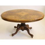 A VICTORIAN WALNUT LOO TABLE, the moulded edged quarter veneered burr top with plain frieze raised