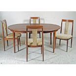 A DANISH ROSEWOOD VENEERED PART DINING SUITE comprising extending D ended table with two separate