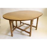 AN ADZED OAK GATELEG DINING TABLE by Colin Almack "Beaverman" of oval form raised on square