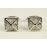 A PAIR OF DIAMOND CUFFLINKS, the square plaques centred by an "X" and pave set with small