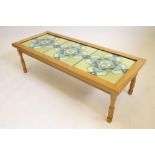 AN OAK COFFEE TABLE by Malcolm Pipes "Foxman", the oblong top with inset woolwork panel worked in