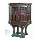 A VICTORIAN STAINED PINE PULPIT of hexagonal form with hinged doors, the moulded cornice and